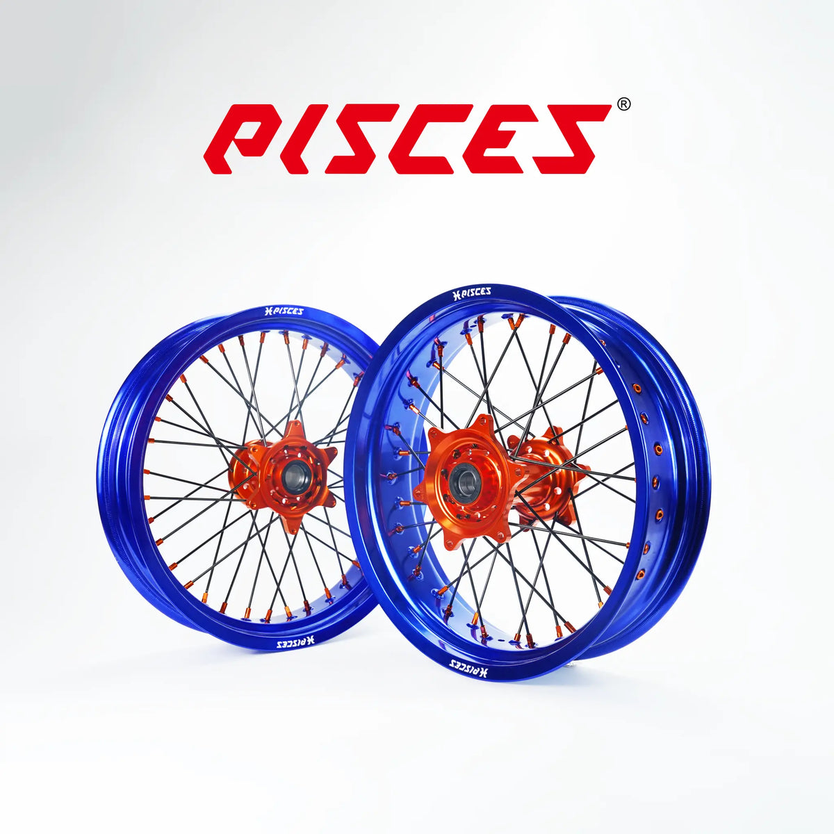 Jeu de roues Supermoto Stark Varg EX MX SM Couleur Unique — jante bleue, moyeu orange, rayons noirs, écrous oranges — référence de couleur personnalisée