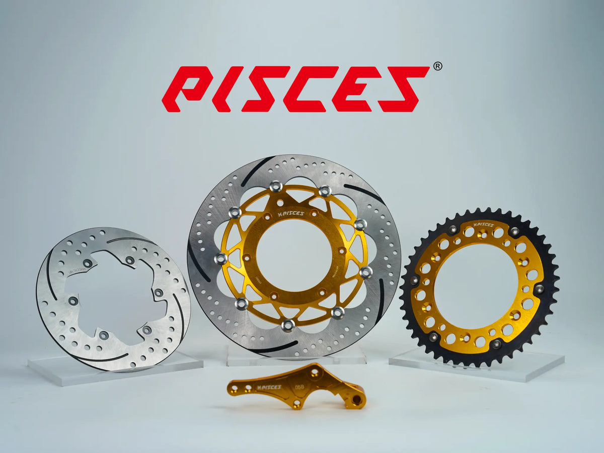 Pisces custom supermoto brake kit 320mm in gold, including gold front brake disc, silver rear brake disc, gold sprocket and gold offset bracket.