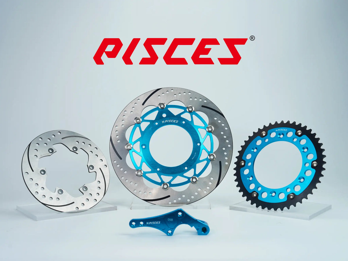 Pisces custom supermoto brake kit 320mm in light blue, including light blue front brake disc, silver rear brake disc, light blue sprocket and light blue offset bracket.
