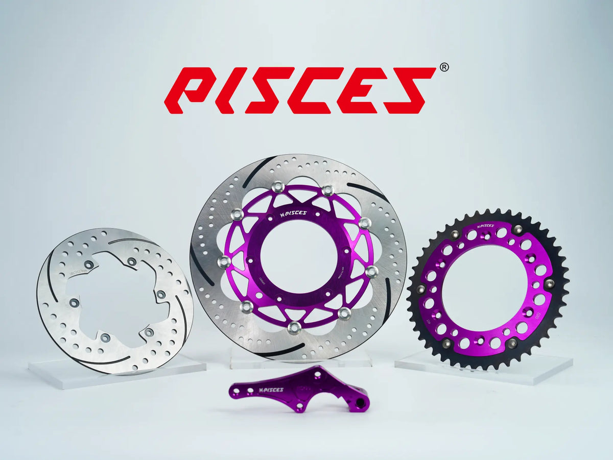 Pisces custom supermoto brake kit 320mm in purple, including purple front brake disc, silver rear brake disc, purple sprocket and purple offset bracket.